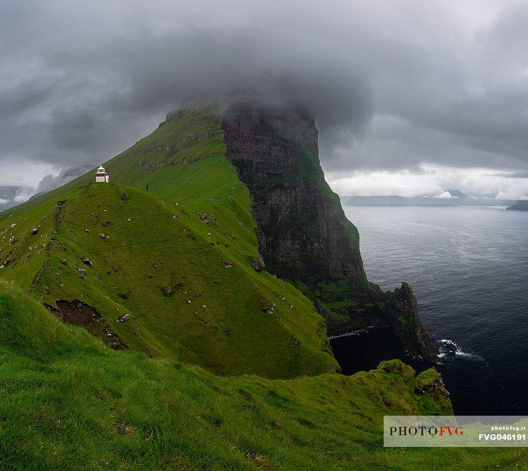 The Kallur lighthouse on the island of Kalsoy, Faeroe islands, Denmark, Europe